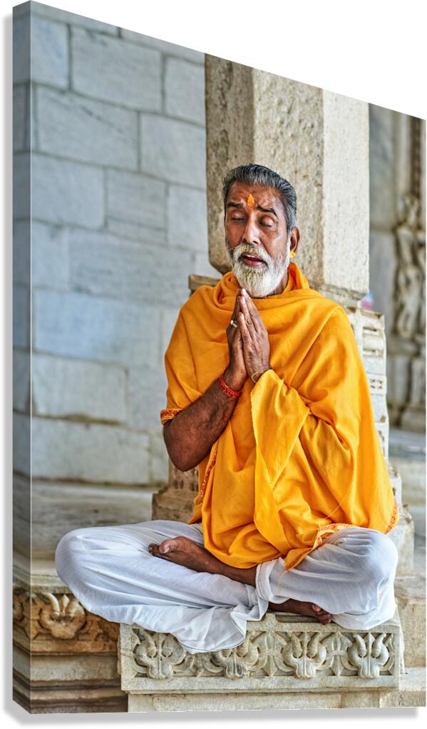 Man prays in Jain temple in Ranakpur Rajasthan during the day Canvas Print