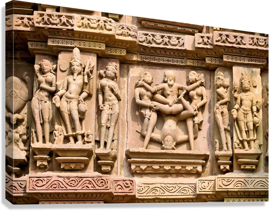 Hindu temples in Khajuraho display intricate erotic carvings Canvas Print