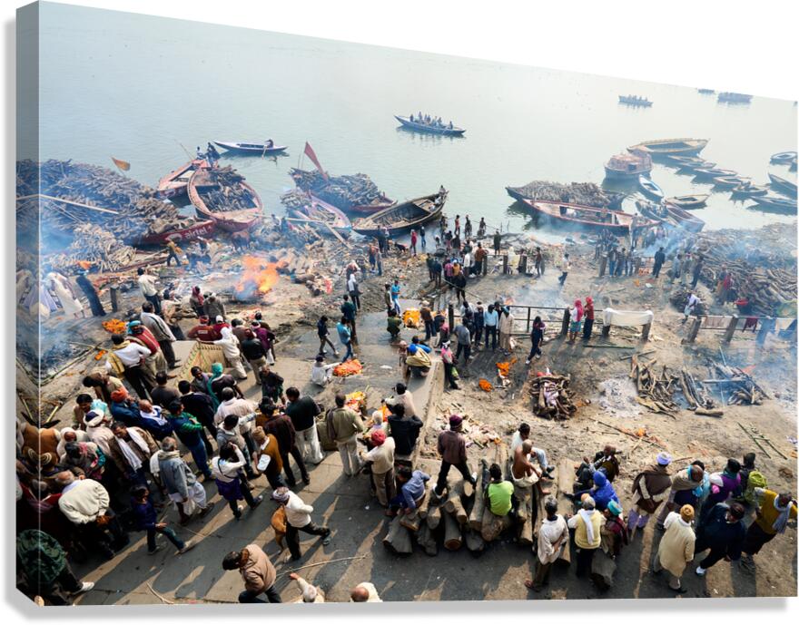 Cremation rites by the river Ganges in Varanasi India Canvas Print