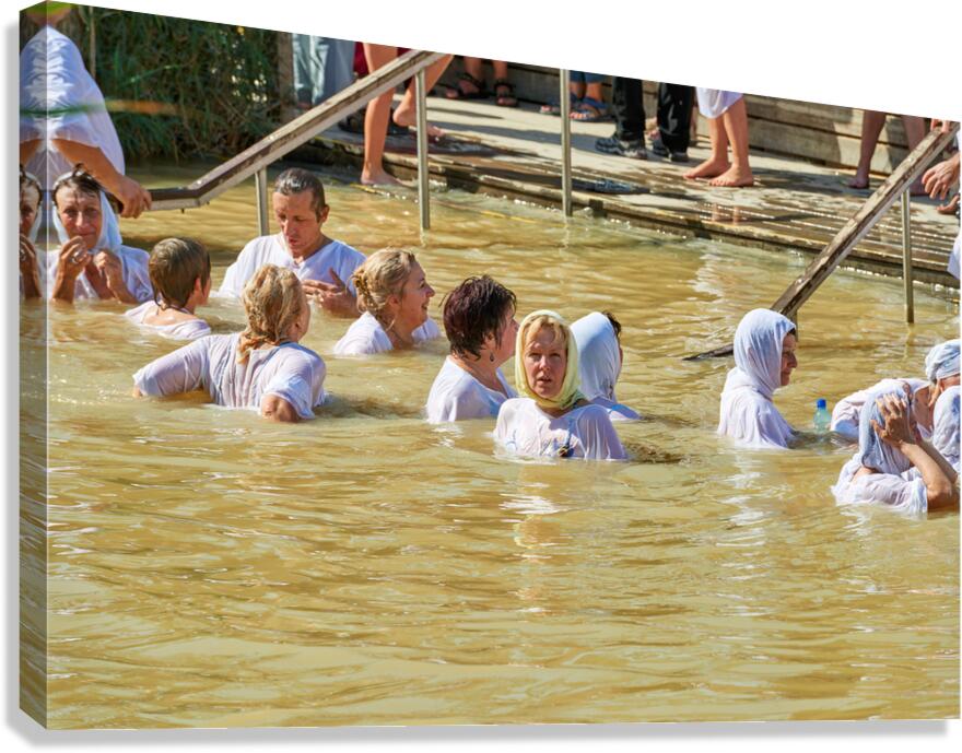 Visitors participate in baptism ceremony at Jordan River site Canvas Print