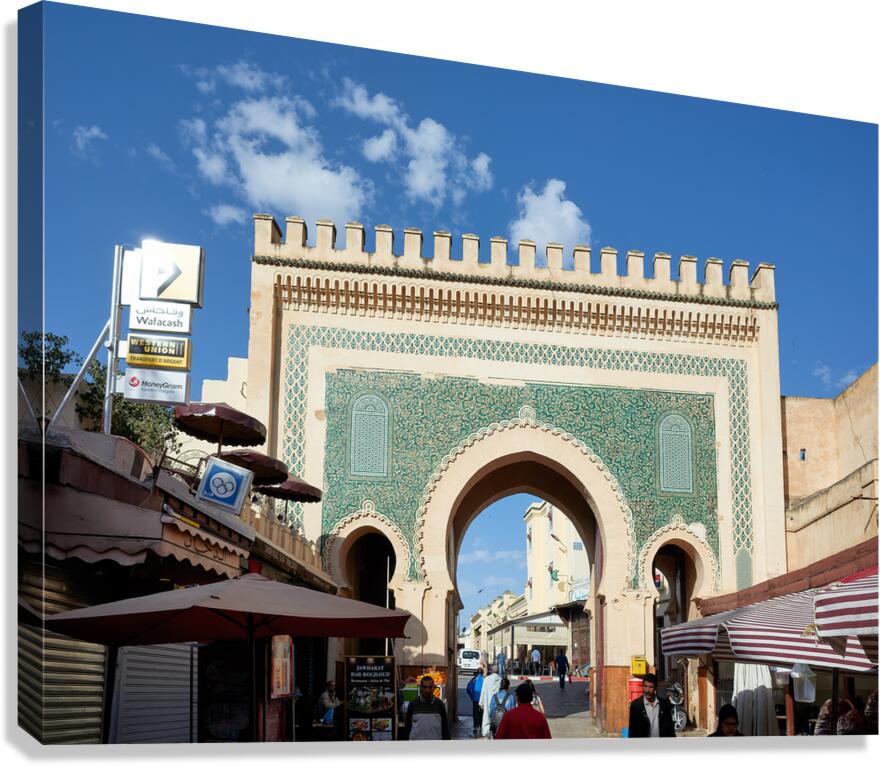 People walk through Bab Bou Jeloud a famous gate in Fez Morocc Canvas Print
