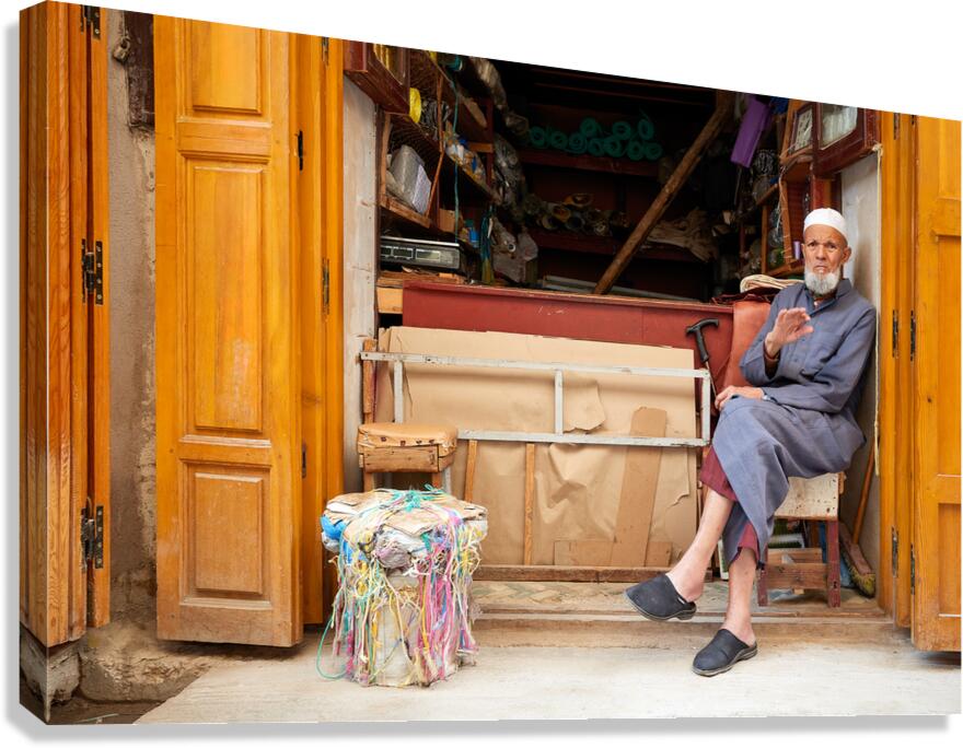 Old man in second hand shop at medina in Fez Morocco Canvas Print