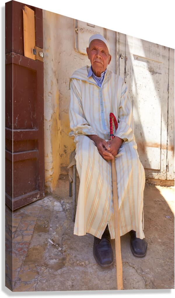 Old man sitting in Meknes Morocco in daylight Canvas Print
