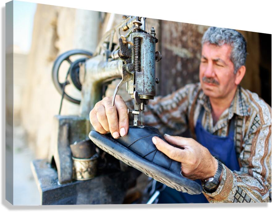 Shoemaker working in Aleppo souq in Syria Canvas Print