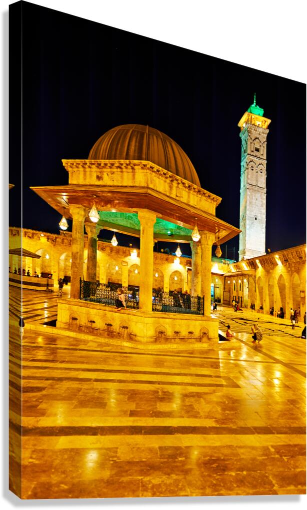 Aleppo mosque at night with lights and visitors in the courtyard Canvas Print