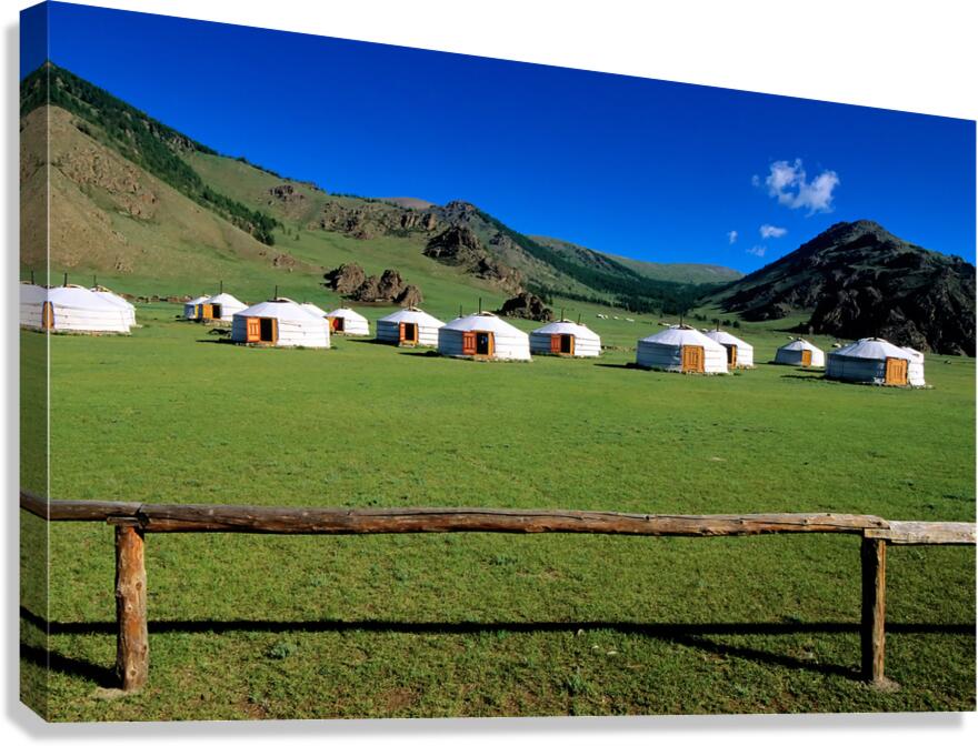 Ger tents in the grassy fields of Mongolia under clear skies Canvas Print