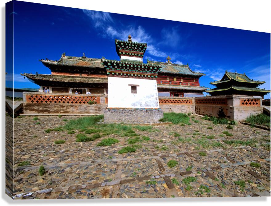 Erdene Zuu Monastery stands in Mongolia under a blue sky Canvas Print
