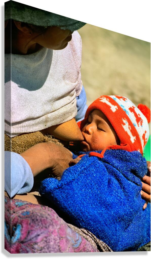Indigenous mother nourishes child in the Andes of Argentina Canvas Print