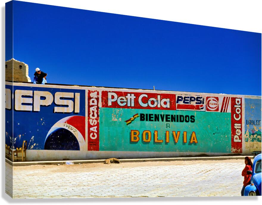 Welcome to Bolivia sign on a wall with old ads. Canvas Print