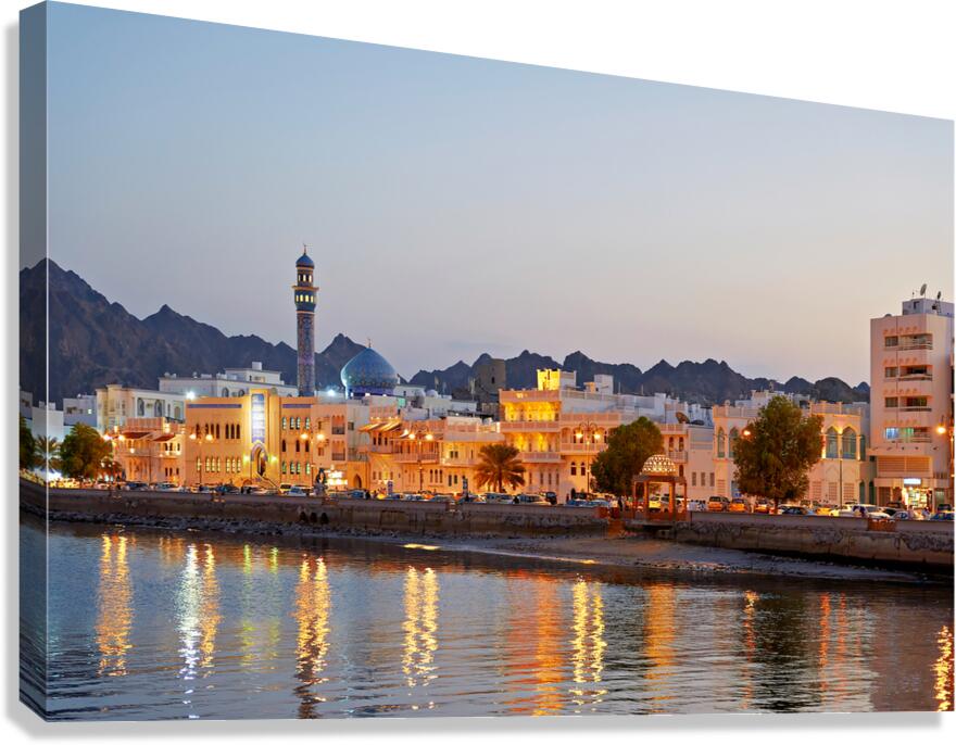 Sunset view of waterfront in Muscat Oman with city lights Canvas Print