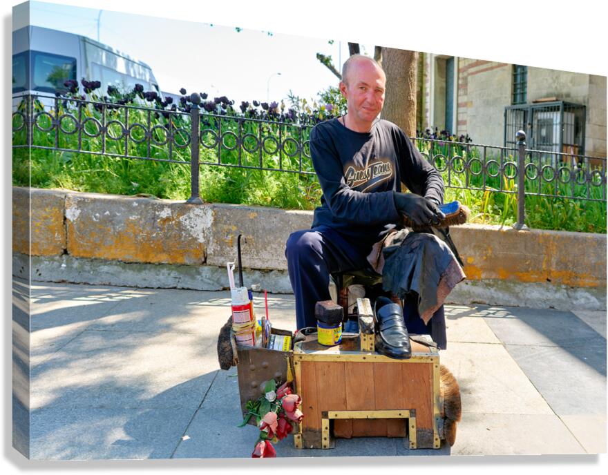 Shoeblack working on shoes in Istanbul Turkey during the day Canvas Print