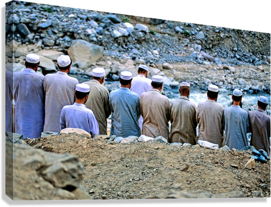 Muslim men pray outdoors in Pakistan facing Mecca Canvas Print