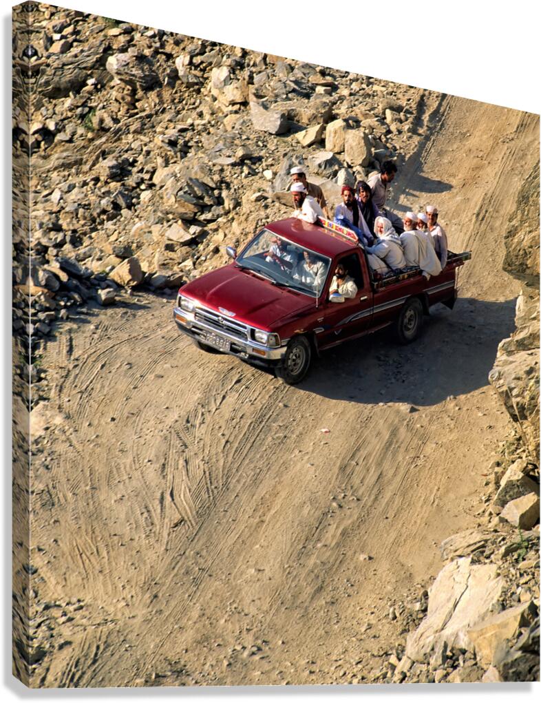 Travelers on gravel road near Shandur Pass in Pakistan Canvas Print