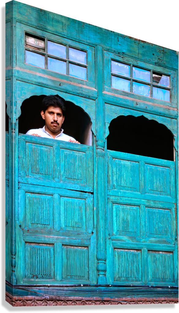 Man looks out from window in Lahore Pakistan Canvas Print
