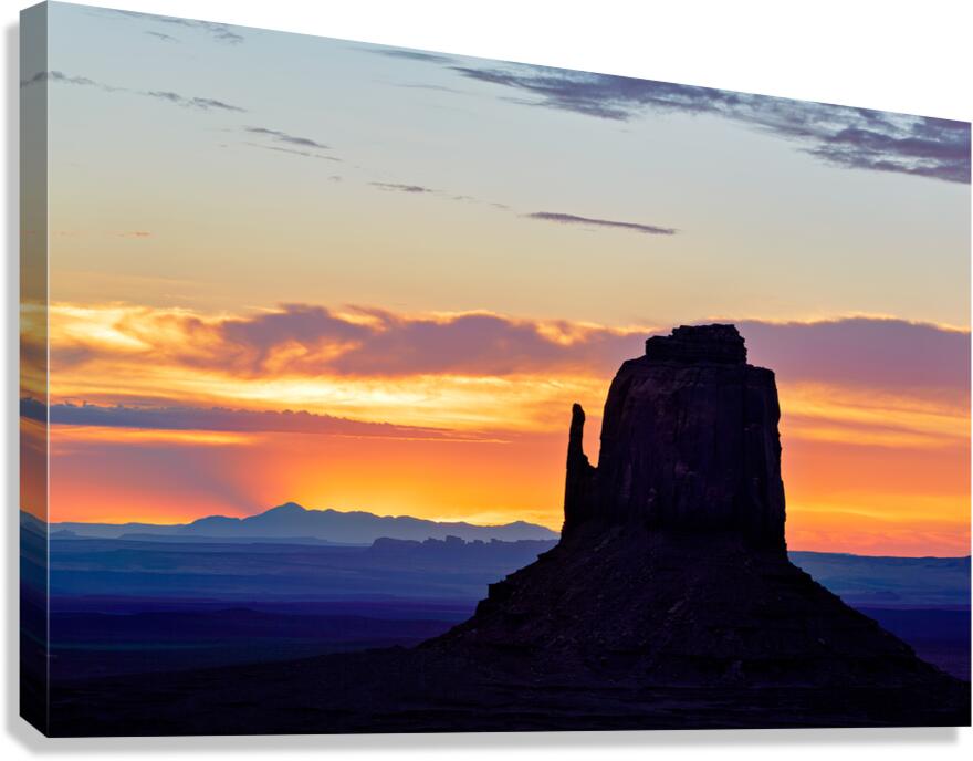 Sunset view over Monument Valley in Utah with dark silhouettes Canvas Print