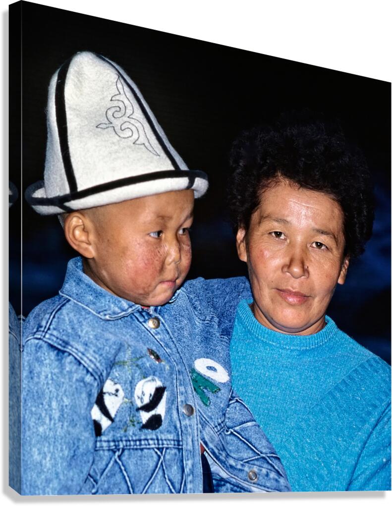 Uzbekistan mother and child in traditional attire during daytime Canvas Print