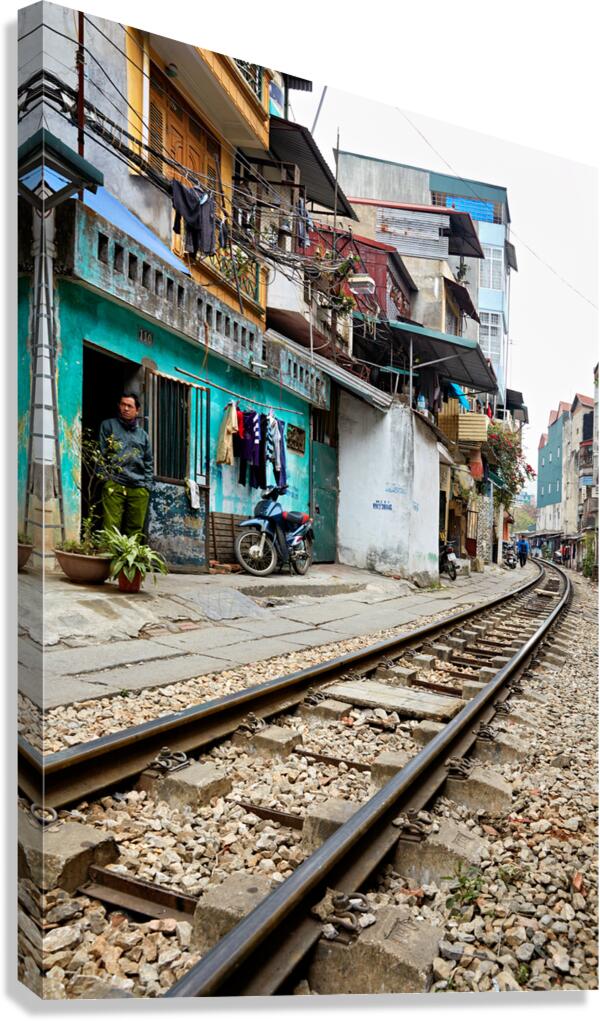 Locals near train tracks in Ho Chi Minh City Vietnam Canvas Print