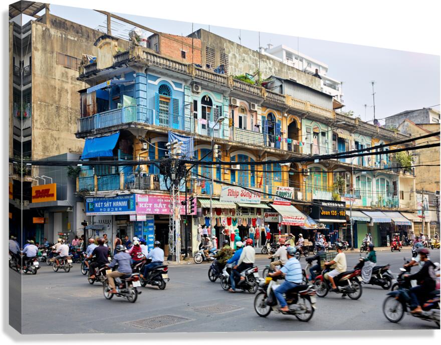 Busy street scene in Ho Chi Minh City with motorbikes and shops Canvas Print