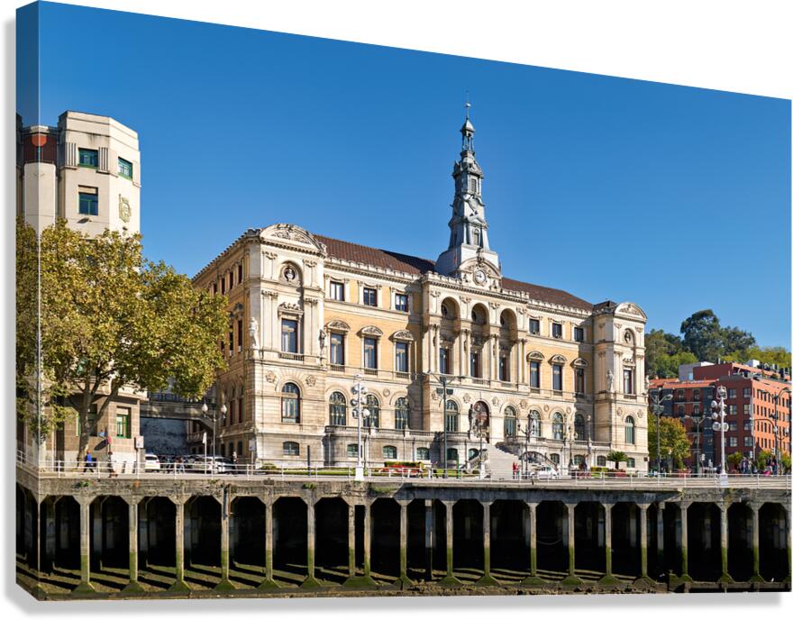 Building stands in Bilbao Spain next to water and trees Canvas Print