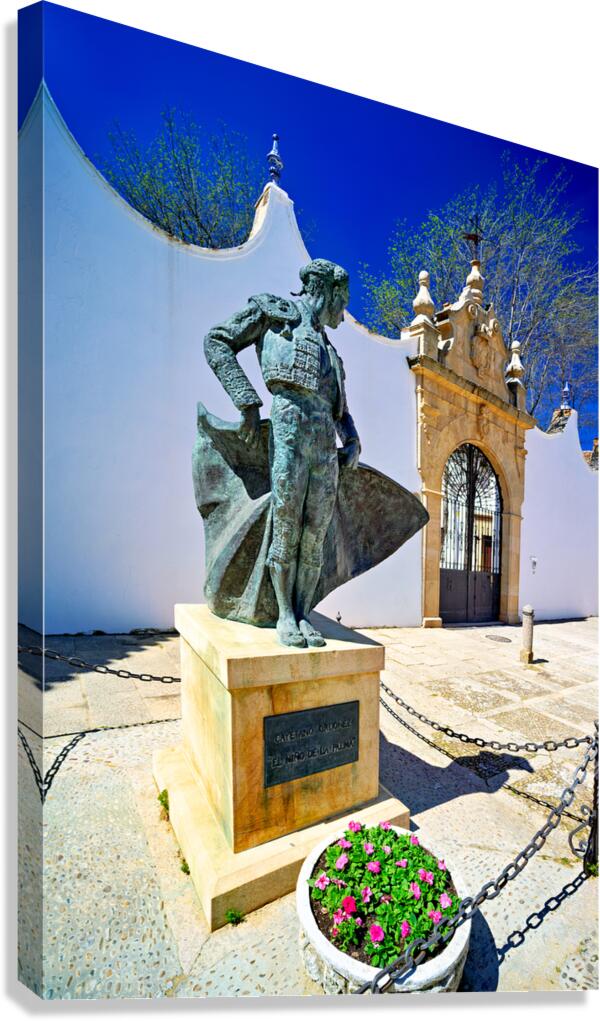 Bullring entrance in Ronda with statue of matador