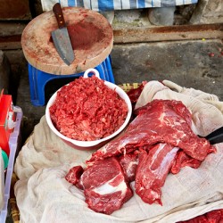 Meat preparation at a market in Ho Chi Minh City