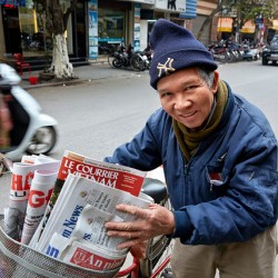 Man selling newspapers in Ho Chi Minh City