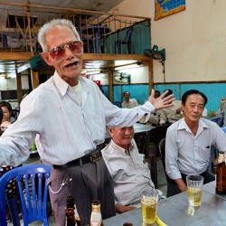 Men gather in Ho Chi Minh Vietnam for drinks and conversation