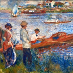 People stand by the water watching individuals rowing