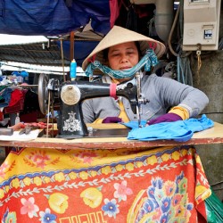 Woman sewing at a market in Phu Quoc Vietnam during the day