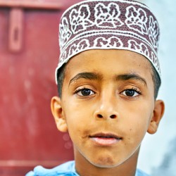 Boy in traditional attire in Muscat Oman during daylight
