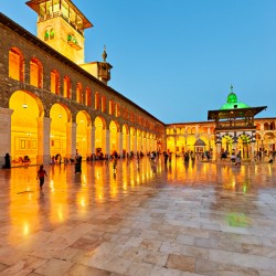 Visitors gather at Umayyad Mosque in Damascus during evening hou