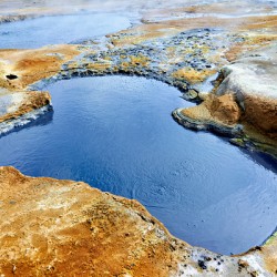 Exploring Hverir hot springs in Iceland during daytime