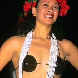 A woman wearing traditional attire dances on Easter Island