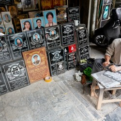 Craftsman making stone engravings in Hanoi Vietnam