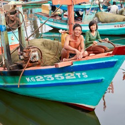 Fishing boats on Phu Quoc island in Vietnam with locals