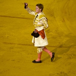 Bullfighter celebrates victory in Seville Arena during a contest
