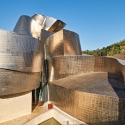 Visit Guggenheim Museum in Bilbao Spain on a sunny day