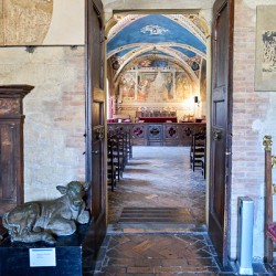 Frescoed hall entrance at Palazzo dei Priori in Volterra