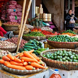 Market scene in Hanoi with fresh vegetables and people