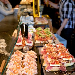 Enjoying classic pinchos in Bilbao Spain at local bar