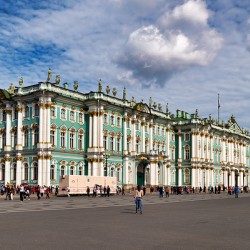 Tourists gather at Winter Palace in Saint Petersburg