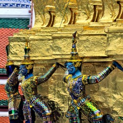 Statues at Wat Phra Kaew in Bangkok showcase cultural heritage