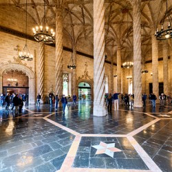 Visitors walk through the hall of Lonja de la Seda in Valencia S