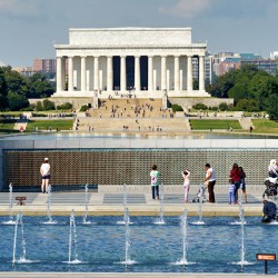 Visitors walk around the National World War II Memorial