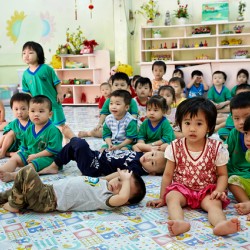 Children gather in classroom in Ho Chi Minh City during lesson