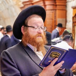 Orthodox Jews engaged in prayer at the Wailing Wall in Jerusalem