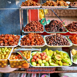 Fruit and snack stall in Hanoi Vietnam during the day