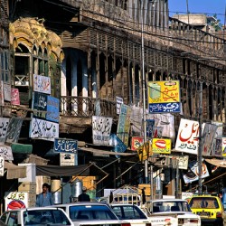 Streets in Peshawar with shops and vehicles