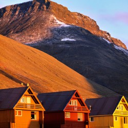 Colorful houses under a mountain in Longyearbyen Svalbard