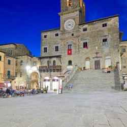 Palazzo del Popolo in Cortona at sunset in Tuscany